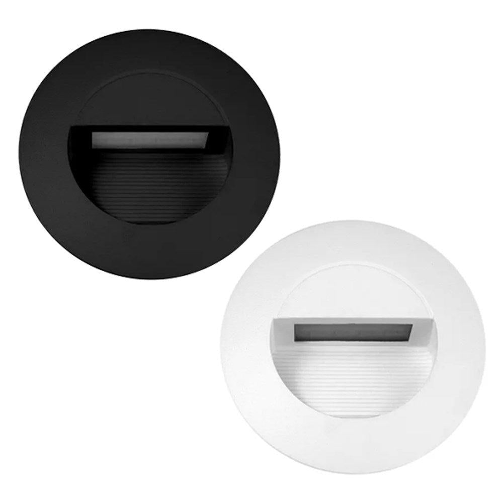 Round matt black and white recessed step lights with a hooded design and ribbed interior detail