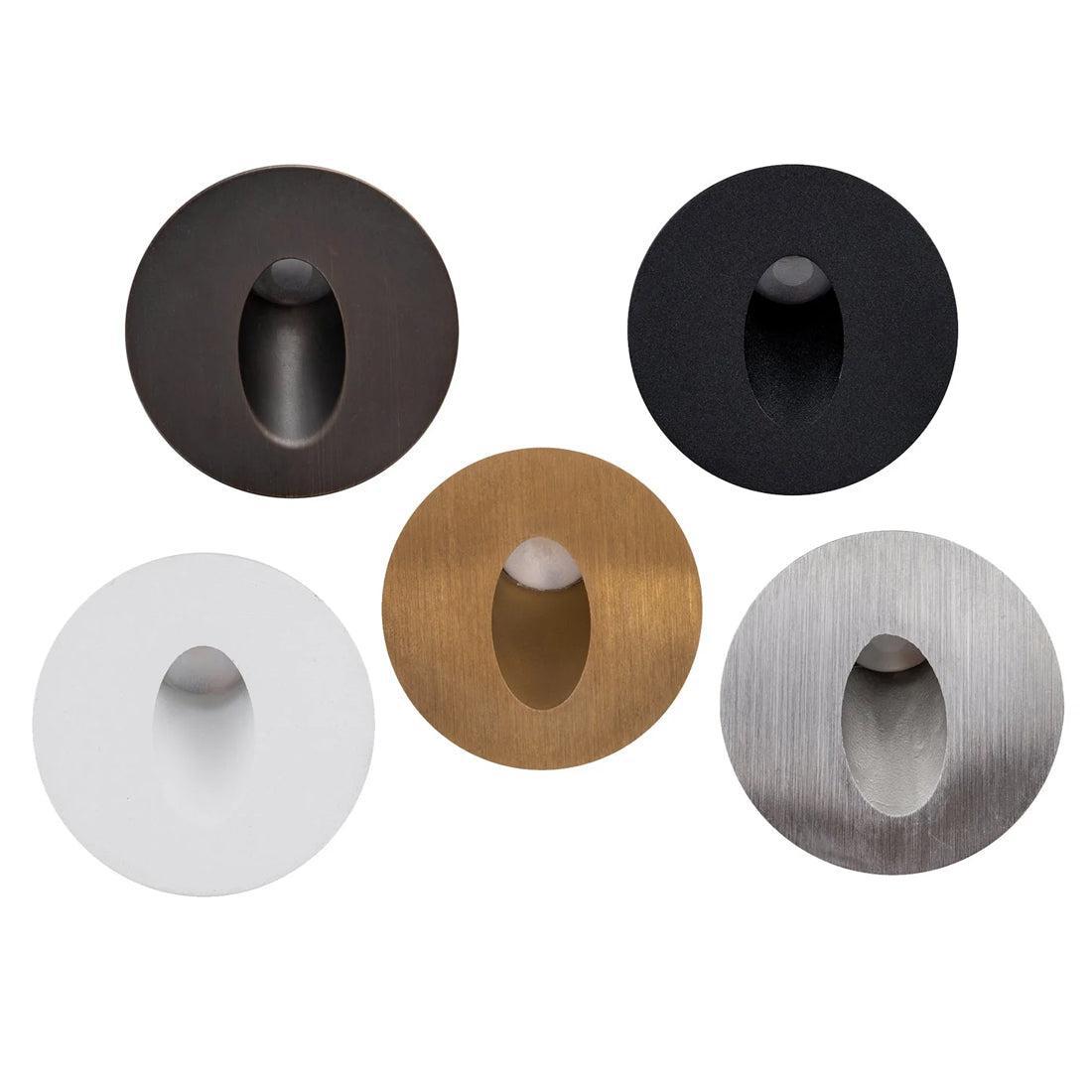 Mini round recessed LED step lights in antique brass, black, white, brass, and stainless steel finishes.